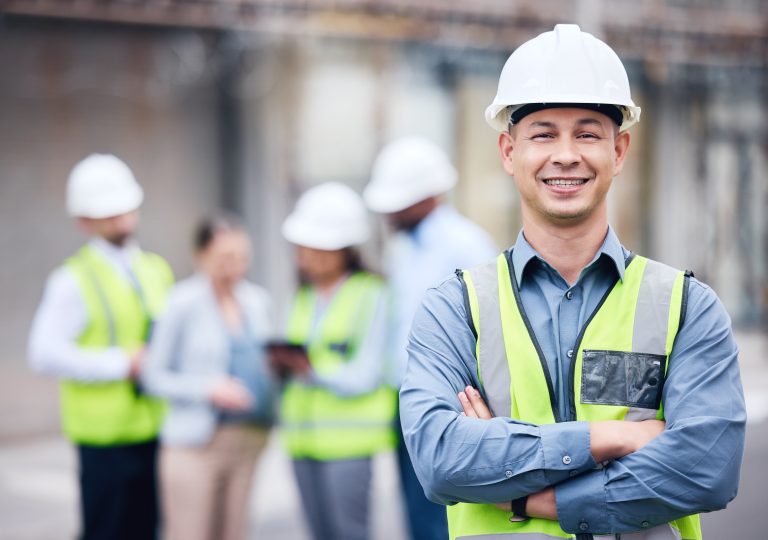 Shot of a mature male architect standing with his arms crossed at a building site.
